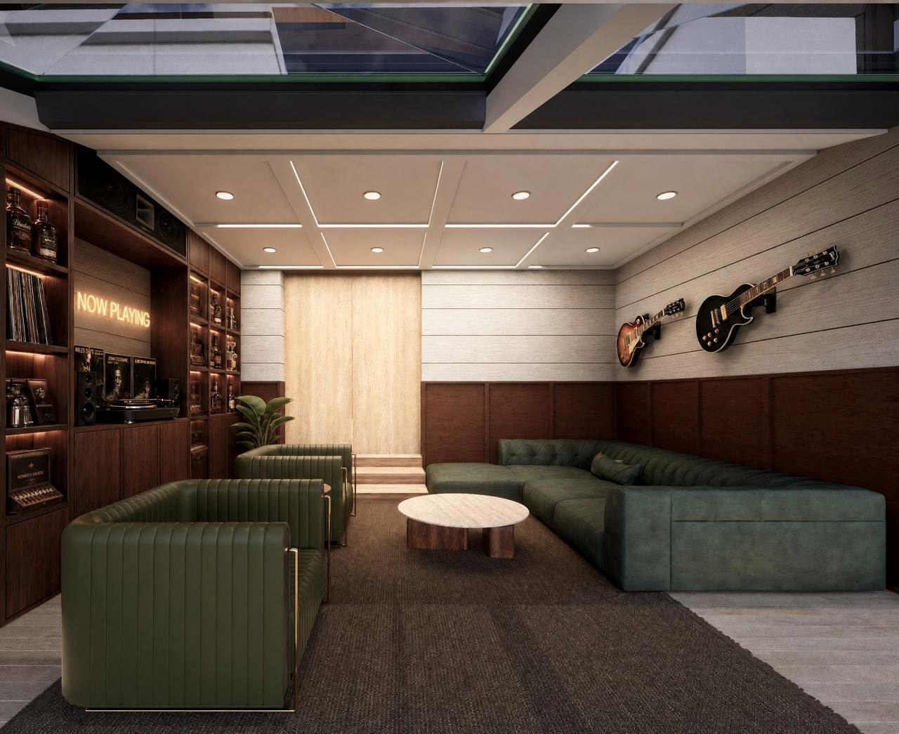 The Delray Residence media room with built-in walnut storage, record display, green lounge seating, guitars, and skylight ceiling