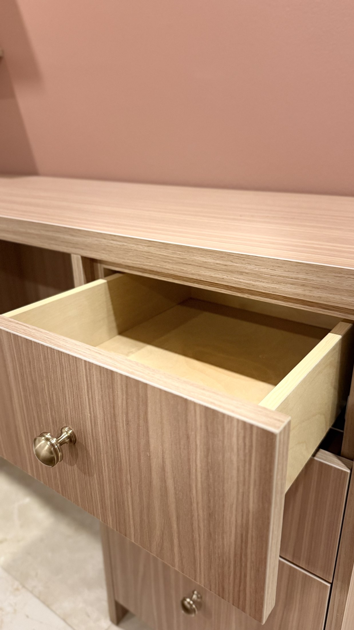 Open drawer detail showing fitted custom millwork construction